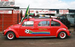The red Beetle carries a large vuvuzela on its roof.