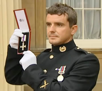 Marine Craig Buchanan receives the Military Cross at Buckinham Palace Marine Craig Buchanan receives the Military Cross at Buckinham Palace