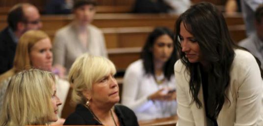 Oscar's sister Aimee is seen talking to Reeva Steenkamp's mother. Oscar's sister Aimee is seen talking to Reeva Steenkamp's mother.