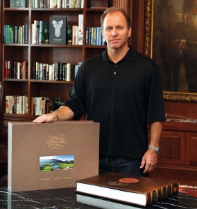 Grant Leversha with a leather-bound copy of 'Within an African Eden' Grant Leversha with a leather-bound copy of 'Within an African Eden'