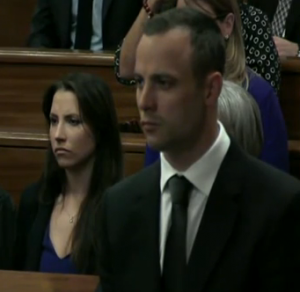 Oscar Pistorius in court today (with his sister in the background) Oscar Pistorius in court today (with his sister in the background)