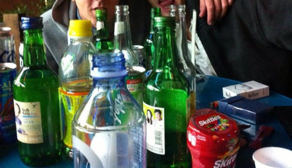 Drinking outside a convenience store. Drinking outside a convenience store.