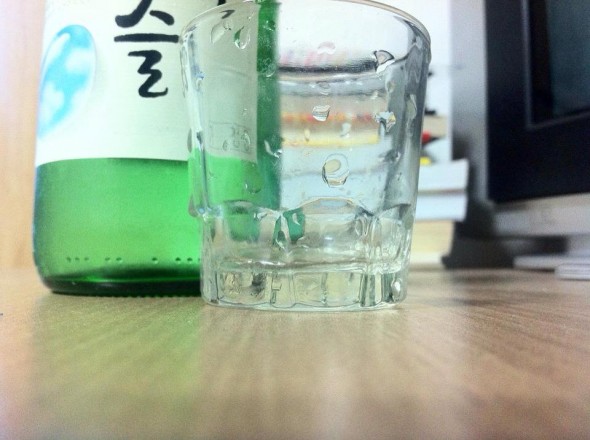 Soju with shot glass. Soju with shot glass.