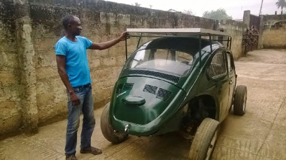 Segun Oyeyiola shows off his solar- and wind-powered Beetle (Image: OAU Peeps) 