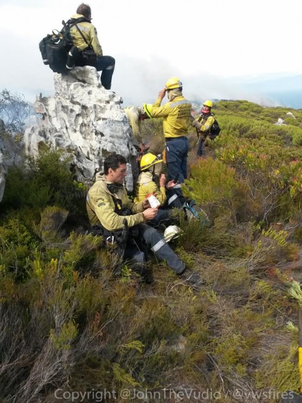 Firefighters earlier today on Muizenberg mountain. Firefighters earlier today on Muizenberg mountain.