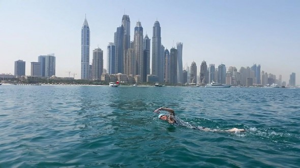 Kieran nearing finish strait - Dubai Marina in background with tallest residential towers in the world. Kieran nearing finish strait - Dubai Marina in background with tallest residential towers in the world.