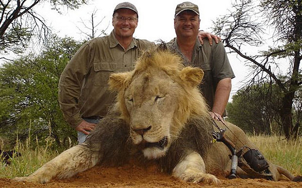 Palmer, on the left, with one of his trophy kills