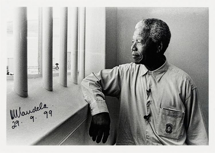 193 Jurgen Schadeberg SOUTH AFRICAN 1931- Mandela in His Cell, Robben Island Signed by Nelson Mandela and dated 29.9.99