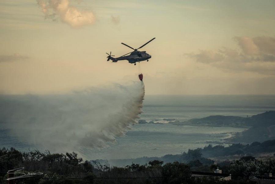 Helicopter dropping water on fire Helicopter dropping water on fire