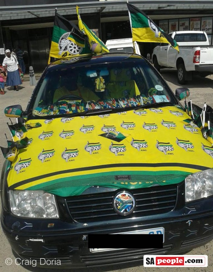 Car covered in ANC flags.