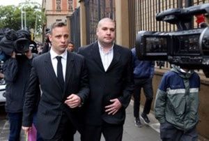Former Paralympian Oscar Pistorius (L) leaves during a court break at the Pretoria High Court, South Africa June 13,2016. REUTERS/Siphiwe Sibeko