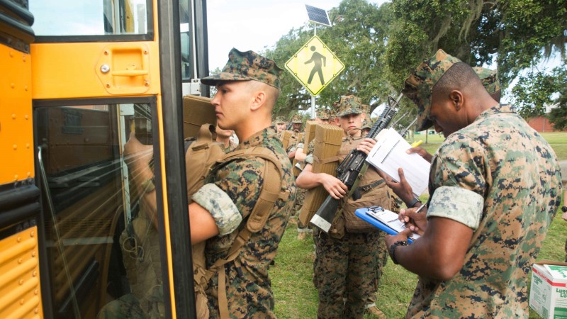 U.S. Marine Corps recruits load buses during an evacuation ahead of the arrival of Hurricane Matthew, from the training facility at Parris Island, South Carolina October 6, 2016.    USMC/Lance Cpl. Carlin Warren/Handout via Reuters