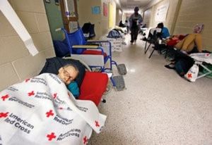 An elderly woman sleeps at a shelter for evacuees in a high school hallway before the arrival of Hurricane Matthew in North Charleston, South Carolina on October 7, 2016. REUTERS/Jonathan Drake