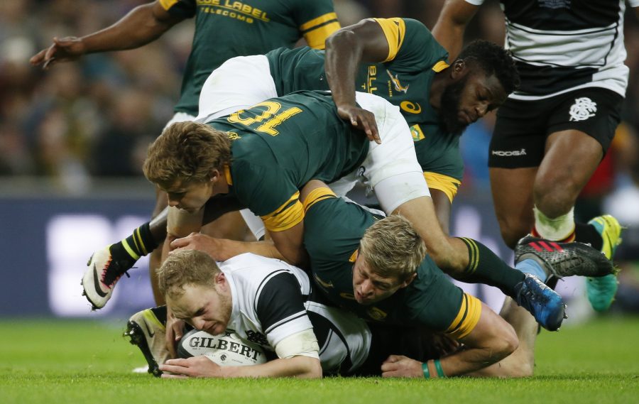 Britain Rugby Union - Barbarians v South Africa - The Killik Cup - Wembley Stadium - 5/11/16 Barbarians' Matt Faddes is tackled by South African's Jamba Ulengo, Pat Lambie (C) and Ruan Combrinck (R) Action Images via Reuters / Paul Childs Livepic EDITORIAL USE ONLY.