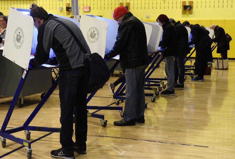 Voters cast their ballots during the U.S. presidential election at Public School P.S. 56 in the Manhattan borough of New York, USA November 8, 2016. REUTERS/Darren Ornitz