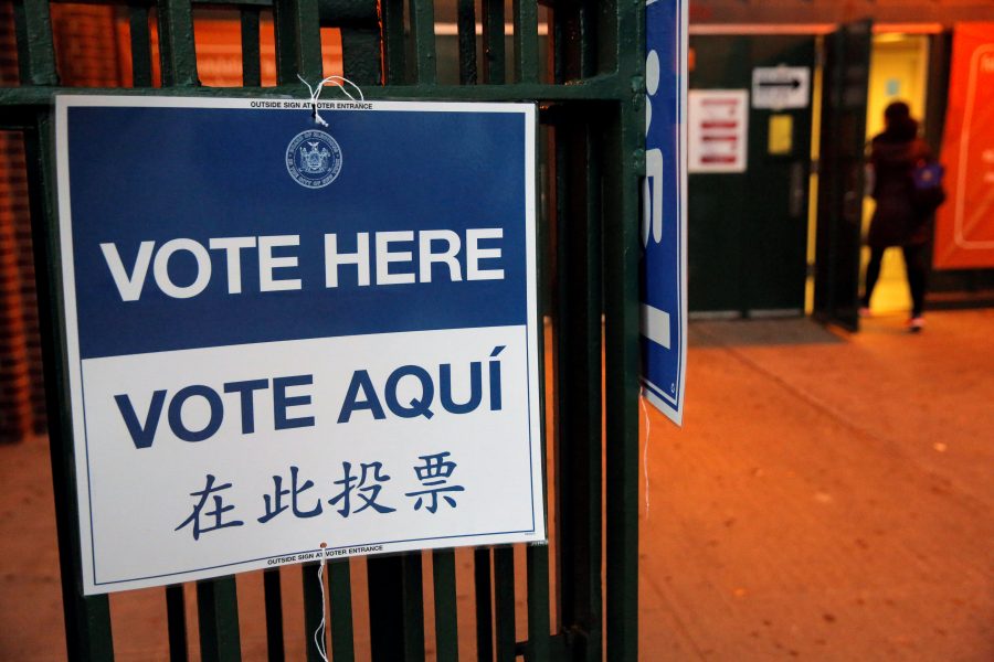 A woman arrives at a polling station at the James Weldon Johnson school in East Harlem on the day of the U.S presidential election in Manhattan, New York City, U.S. November 8, 2016. REUTERS/Andrew Kelly