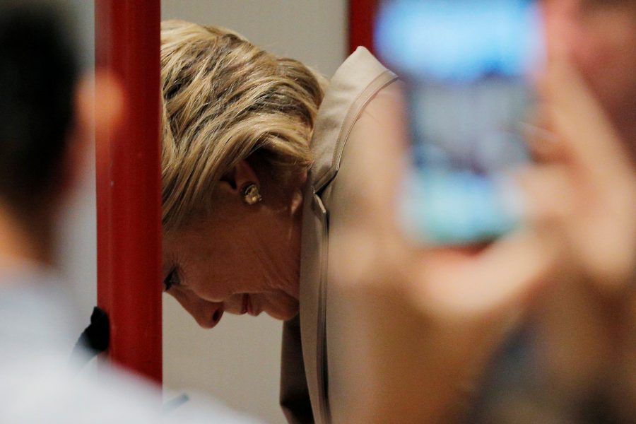 Hillary Clinton fills out her ballot at the Douglas Grafflin Elementary School in Chappaqua, New York. REUTERS/Brian Snyder