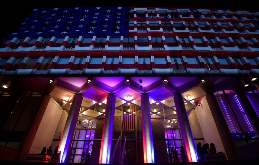U.S. flags are projected on the facade of the U.S. Embassy, during the U.S. Presidential election in London, November 8, 2016. REUTERS/Hannah McKay