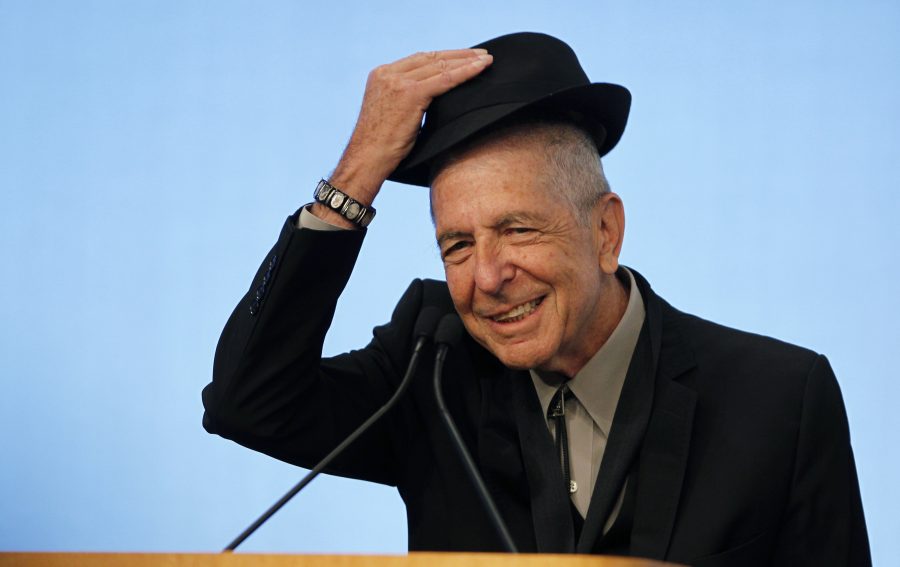 Musician Leonard Cohen tips his hat to the audience as he accepts the 2012 Awards for Song Lyrics of Literary Excellence, which was awarded to both he and Chuck Berry at the John F. Kennedy Presidential Library and Museum, in Boston, Massachusetts, U.S. on February 26, 2012. REUTERS/Jessica Rinaldi/File Photo