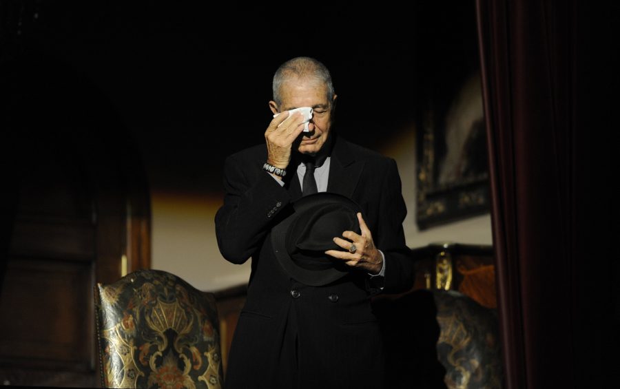 Canadian singer-songwriter Leonard Cohen cries during a tribute in Gijon, northern Spain on October 19, 2011. REUTERS/Eloy Alonso/File Photo