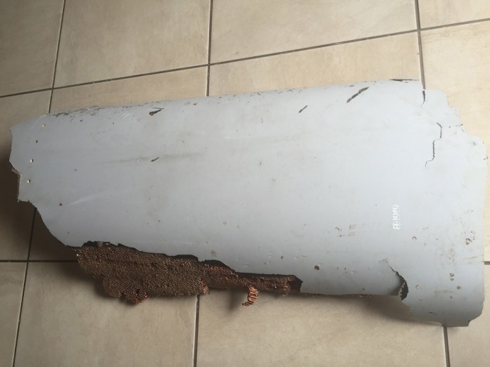 Handout photo of piece of debris found by a South African family off the Mozambique coast, which authorities will examine to see if it is from missing Malaysia Airlines flight MH370