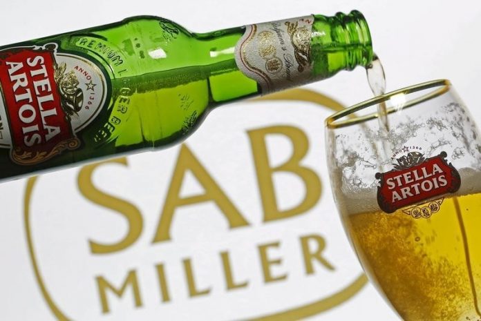 Photo illustration of beer flowing from a bottle of Stella Artois into a glass sab miller