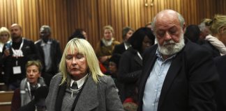June and Barry Steenkamp react after the sentence hearing of Olympic and Paralympic track star Oscar Pistorius at the North Gauteng High Court in Pretoria