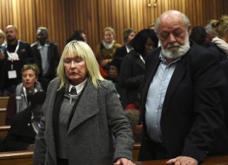 June and Barry Steenkamp react after the sentence hearing of Olympic and Paralympic track star Oscar Pistorius at the North Gauteng High Court in Pretoria