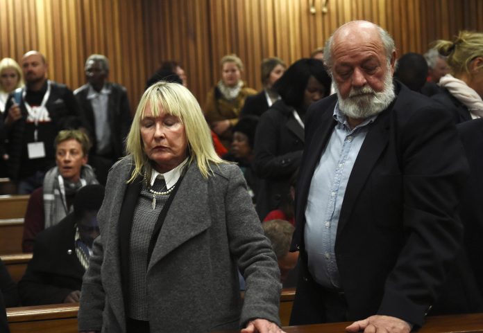 June and Barry Steenkamp react after the sentence hearing of Olympic and Paralympic track star Oscar Pistorius at the North Gauteng High Court in Pretoria