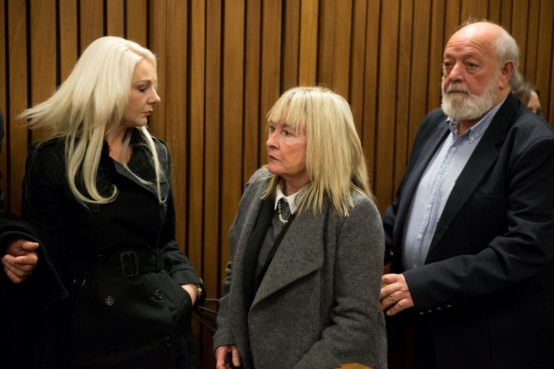 June and Barry Steenkamp leave the court after the sentence hearing of Olympic and Paralympic track star Oscar Pistorius at the North Gauteng High Court in Pretoria