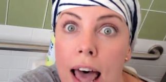 Charlize Theron sitting on the toilet