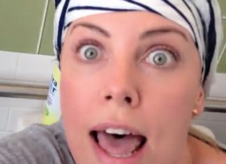 Charlize Theron sitting on the toilet