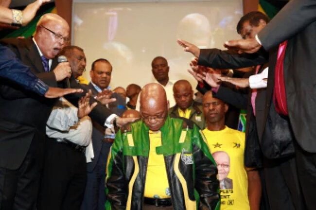 Zuma with people praying