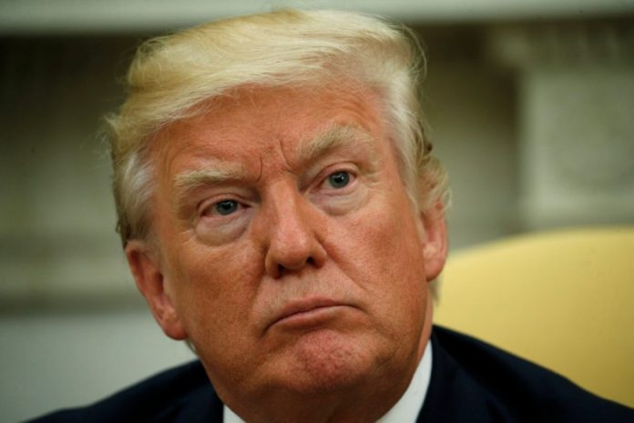 FILE PHOTO: U.S. President Donald Trump listens to question from the media at the White House in Washington