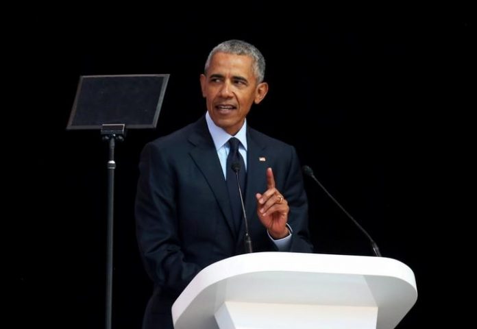 Former U.S. President Barack Obama delivers the 16th Nelson Mandela annual lecture, marking the centenary of the anti-apartheid leader's birth, in Johannesburg