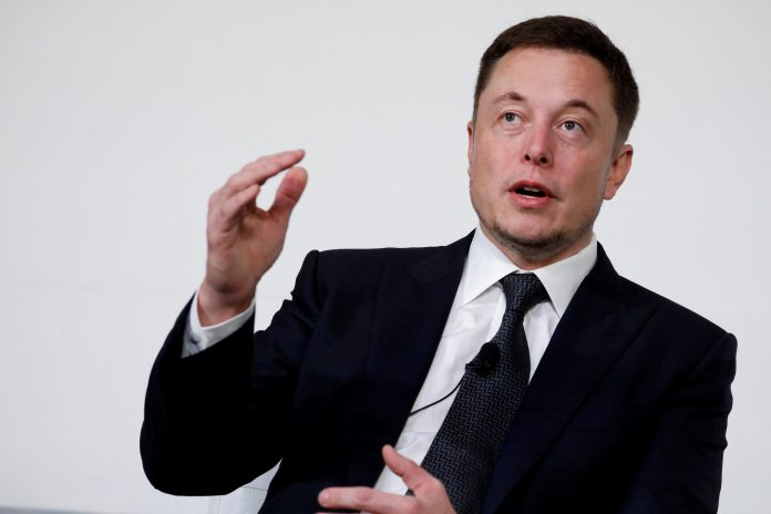 FILE PHOTO: Elon Musk, founder, CEO and lead designer at SpaceX and co-founder of Tesla, speaks at the International Space Station Research and Development Conference in Washington