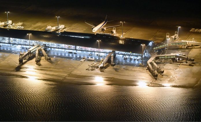 An aerial view shows a flooded runway at Kansai airport, which is built on a man-made island in a bay, after Typhoon Jebi hit the area, in Izumisano
