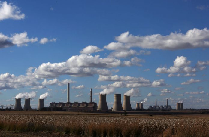 Smoke rises from the cooling towers of Matla Power Station, a coal-fired power plant operated by Eskom in Mpumalanga province