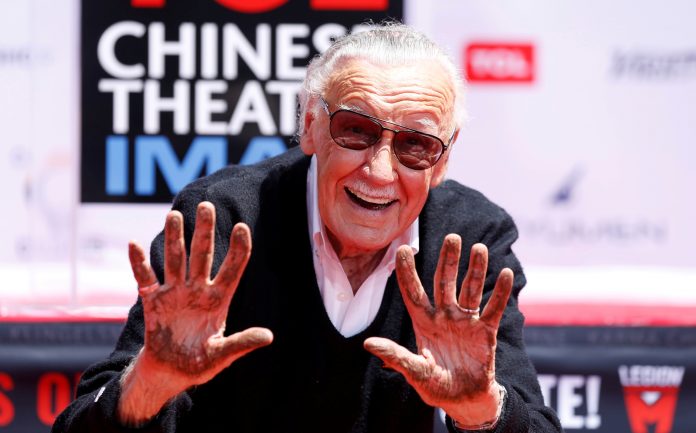 FILE PHOTO: Marvel Comics co-creator Lee shows his hands after placing them in cement during a ceremony in the forecourt of the TCL Chinese theatre in Los Angeles