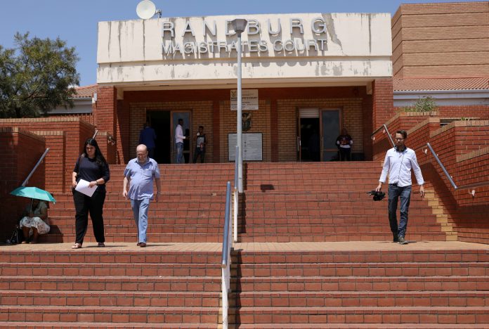 People leave the Randburg magistartes court after the appearance of Anna Britta Troelsgaard Nielsen, a former employee of the Danish National Board of Social Services, in Randburg