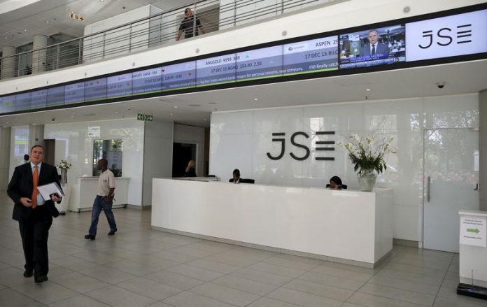 People walk near the reception at the Johannesburg Stock Exchange in Sandton, Johannesburg