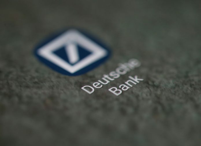 The Deutsche Bank app logo is seen on a smartphone in this illustration