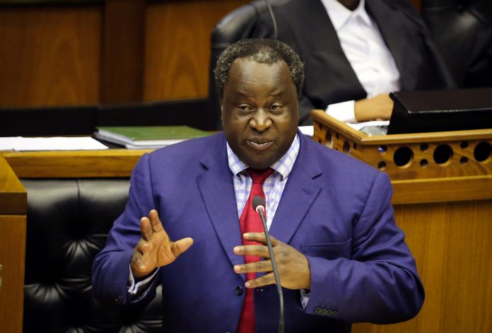South African Finance Minister Tito Mboweni gestures as he delivers his budget speech at Parliament in Cape Town