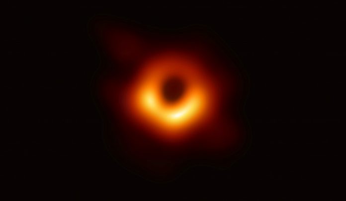 Handout photo of the first ever photo a black hole, taken using a global network of telescopes, conducted by the Event Horizon Telescope (EHT) project