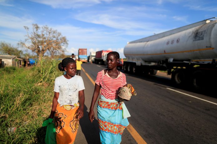The Wider Image: Lives washed away: A mother's loss in Mozambique