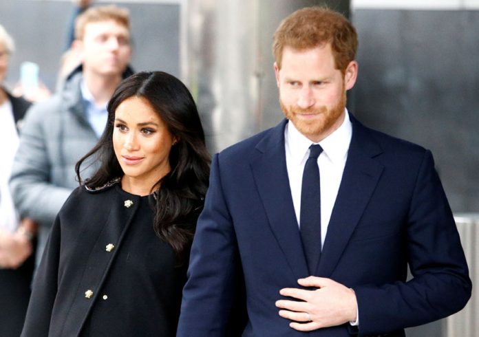 Britain's Prince Harry and Meghan, Duchess of Sussex visit the New Zealand House to sign the book of condolence on behalf of the Royal Family in London