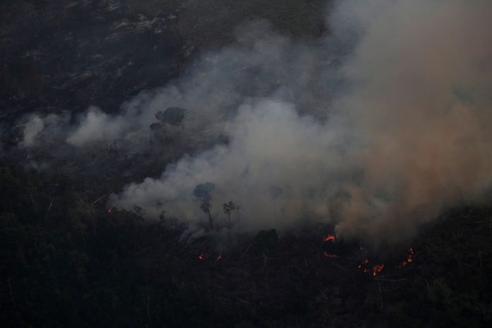 Smoke billows during a fire in an area of the Amazon rainforest near Porto Velho, Rondonia