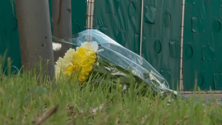 Essex resident lays flowers at scene where bodies found in lorry