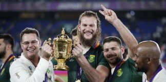 South Africa head coach Rassie Erasmus and South Africa's RG Snyman pose with the Webb Ellis Cup they celebrate winning the world cup final.