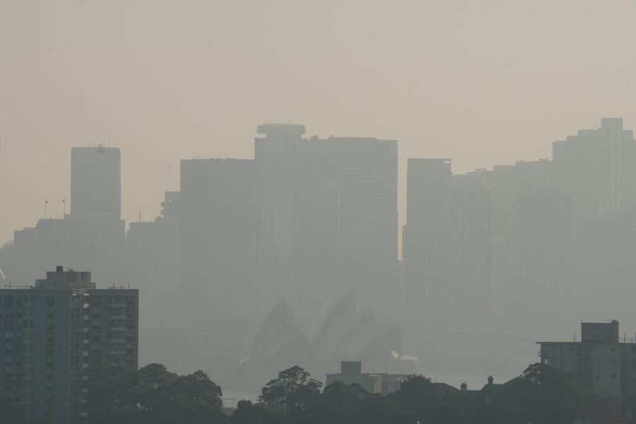 The Sydney Opera House is seen through smoke from bushfires in Sydney